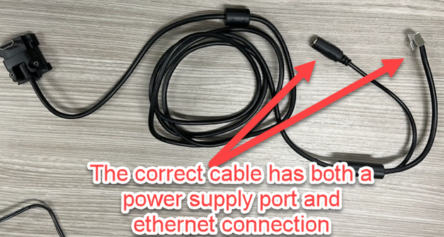 A black cable with red arrows pointing to it

Description automatically generated